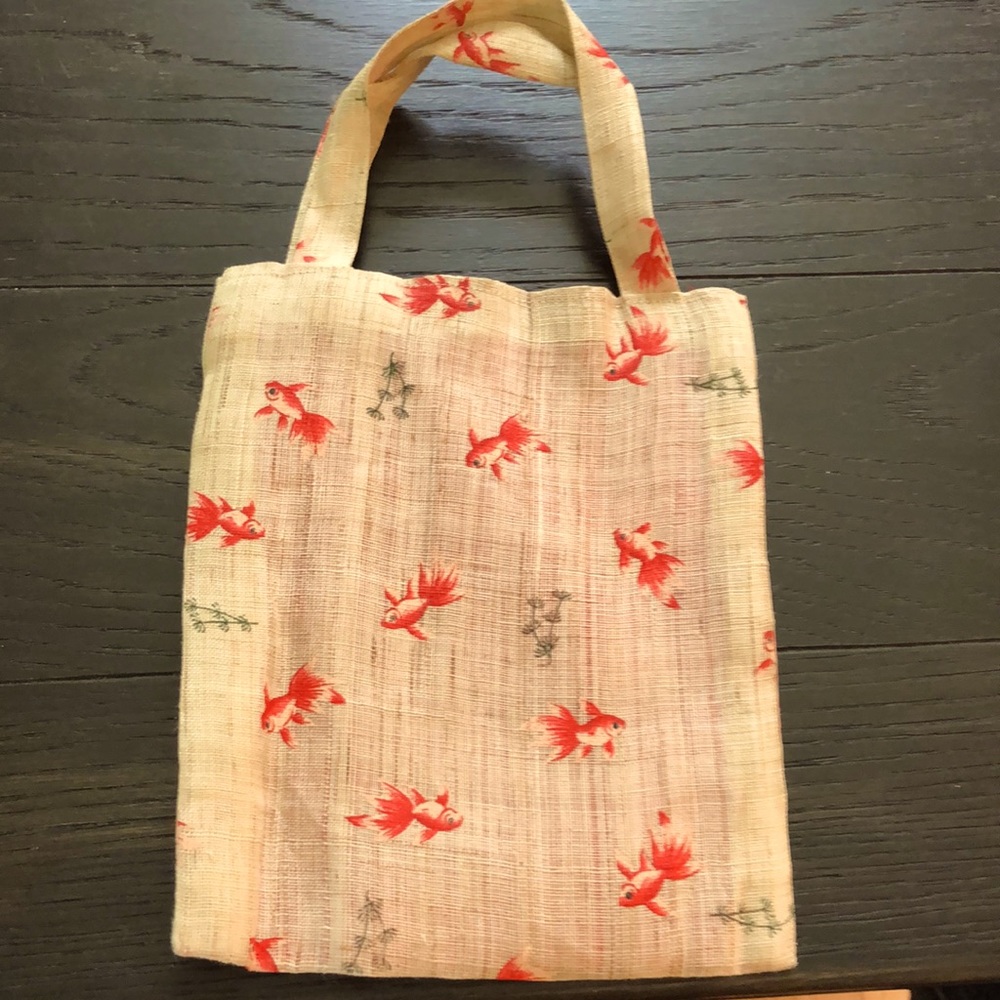 Woven fiber and painted koi bag